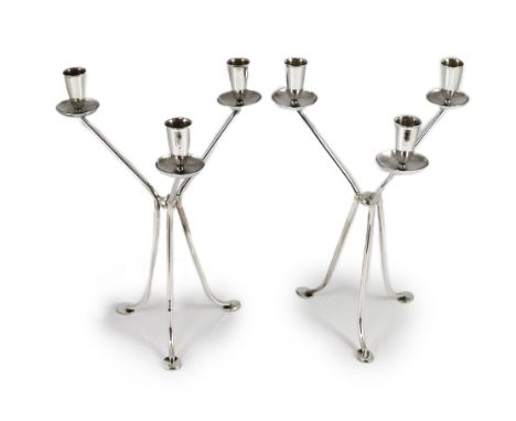 A modern pair of stylish three branch, three light candelabra by Harrods Ltd,on tripod supports, London, 1965, height 30.5cm,