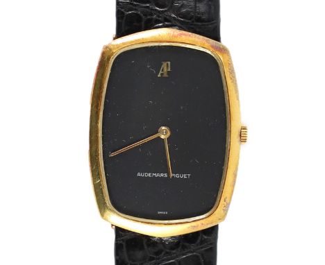 A gentleman's 18ct gold Audemars Piguet manual wind dress wrist watch,with black dial, on an Audemars Piquet black leather st