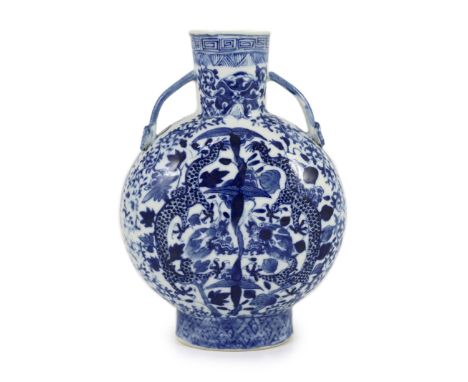 A Chinese blue and white ‘dragon’ moon flask, late 18th century,each side painted with confronting dragons amid scroll in fol