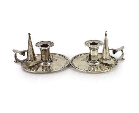 A pair of early Victorian silver circular chambersticks, by R &amp; S Garrard &amp; Co,with engraved crests, London, 1842, di