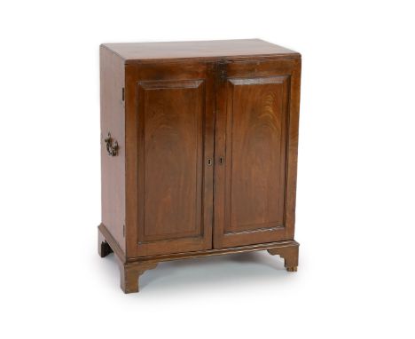 A George III mahogany secretary's cabinet,of plain rectangular form with two fielded panelled doors, brass loop handles and b