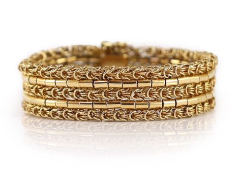 A 20th century 18k gold interwoven three row bracelet,with safety chain. interior length approx. 17cm, 69.4 grams.Overall con