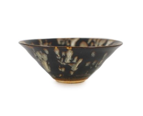 A Chinese Jizhou tortoiseshell glazed tea bowl, Song dynasty,12.3cmThere’s a fine crackle to the glaze all over with remnants