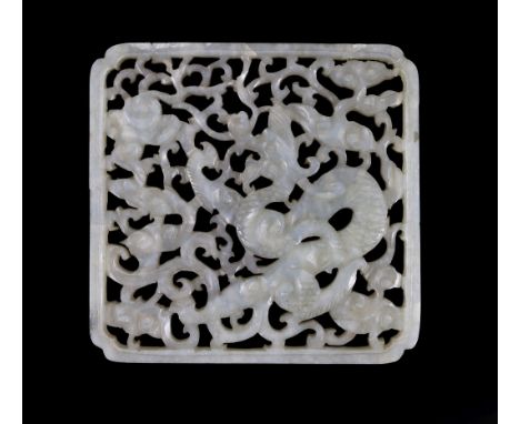 A Chinese pale celadon jade ‘Dragon’ plaque, 17th/18th centurypierced and carved with a dragon amid scrolling tendrils and li