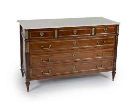 A 1790's French Directoire period brass mounted mahogany commode,with veined white marble top over three frieze and three gra