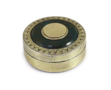 A George III engine turned silver gilt and inset bloodstone circular snuff box and cover, maker's mark rubbed,with embossed f