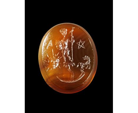 'Magische Gemme' aus braunem Karneol. 19. - 20. Jh. H 2,3cm. Hochoval, beidseitig Intaglio. A: Ein nackter Frauenkörper auf e
