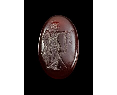 Karneolgemme mit Athena. Baktrisch, 2. Jh. v. Chr. H 2,7cm. Roter Karneol, auf dem hochovalen Intaglio stehende, behelmte Ath