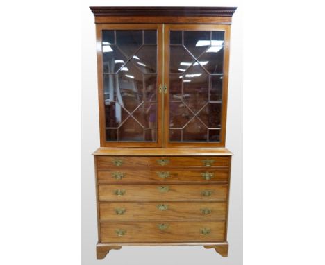 19th Century mahogany secretaire bookcase, the glazed top above a fitted drawer, three long drawers under on bracket feet, 28