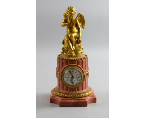 19th century pink marble and gilt metal mantel clock , enamelled dial with single train movement,  26cm        