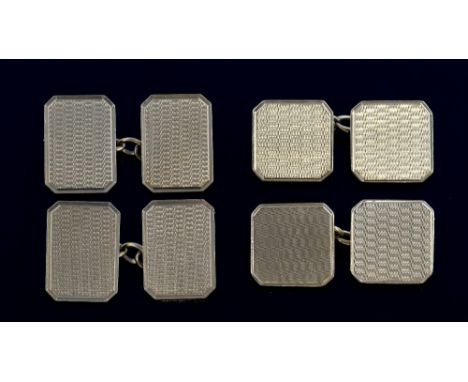 Two pairs of gold cufflinks with engine turned decoration, 9 ct   21  grams 