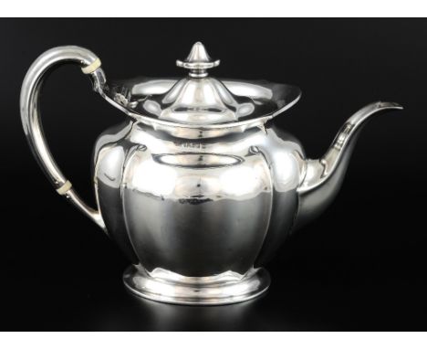 Edward VII silver teapot with serpentine rim on oval foot, by Atkin Brothers, Sheffield, 1906, gross weight 21.2oz, 660g,PLEA