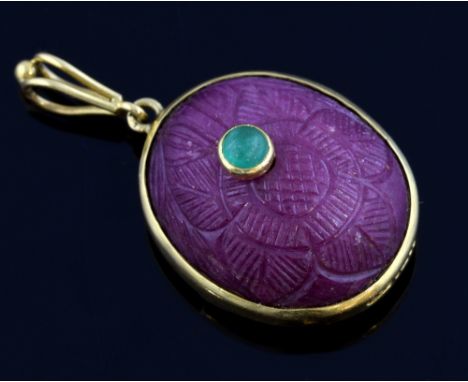 Pendant with carved corundum ruby and cabochon emerald  set in 18 ct gold  Gross weight - 14.5 grams2 x 2.5 cm