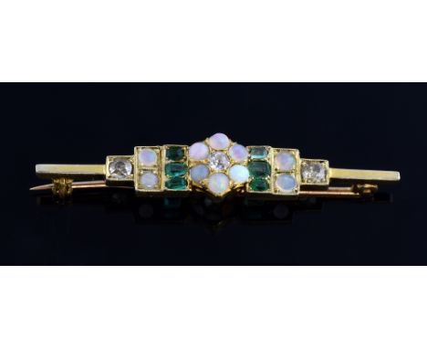 Gold bar brooch with central opal and diamond set flower, emerald and opal in a box setting, flanked by two diamonds, central