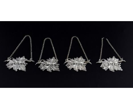 Set of four Victorian silver decanter labels in the form of vine leaves, comprising 'SHERRY', 'PORT', 'MADEIRA' and 'CLARET',