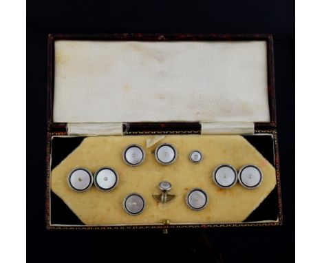 Cased set of Edwardian cufflinks and shirt studs, pearl centres with mother of pearl within a black border, mounted in white 