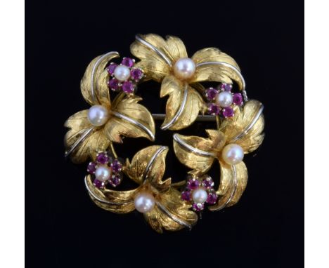  Vintage gold brooch modelled as a floral cluster with leaves in two colour gold, ruby and pearl flowers,18 ct gold, 3.5 x 3.