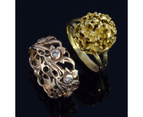 Two gold rings, an openwork floral design set with diamonds, ring size M and a gold cluster ring, tested as 18 ct, ring size 