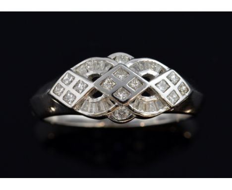 Diamond dress ring, set with princess and baguette diamonds mounted in 18ct white gold. Ring size O Gross weight 5.1 grams