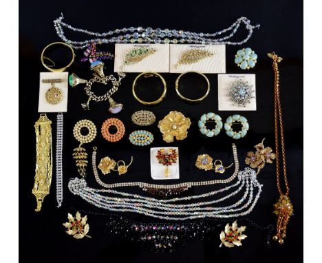 A large collection of vintage costume jewellery including glass floral necklace, cufflinks, and a quantity of unopened packet