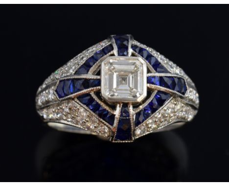 Sapphire and diamond dress ring, set with a asscher cut diamond weighing approximately 0.60 carats to the centre with calibre