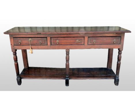 18th oak dresser with three drawers, on column supports with under-shelf, 83cm x 183cm       