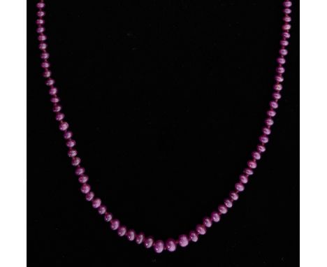 Ruby bead necklace, of graduated off-round beads to a silver clasp, 58 cm length  Gross weight 25 grams 