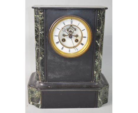 Polished slate and green marble twin train mantel clock, 32 x 28cm PROVENANCE: Consigned from a local deceased estate, the pr