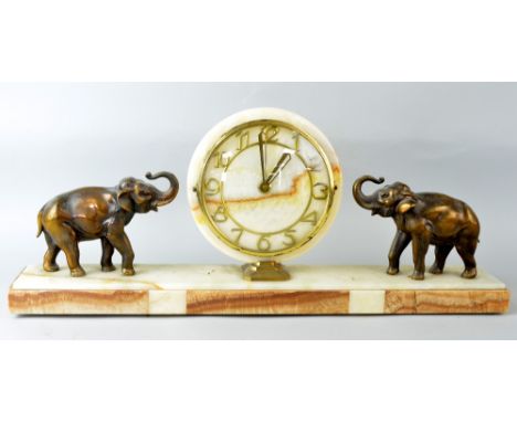 1920's onyx mantel clock with two gilt metal elephants, 28 x 67cm PROVENANCE: Consigned from a local deceased estate, the pro