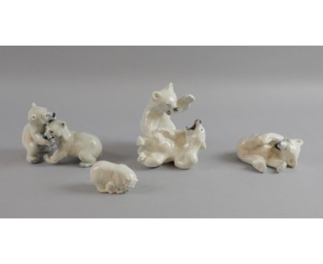 Three Royal Copenhagen bear groups, No 729, young polar bear, 4780, polar bear with cubs, 1107, polar bear playing and a Dahl