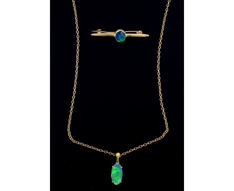 Opal doublet pendant and 9ct gold chain with a opal doublet bar brooch in yellow metal  