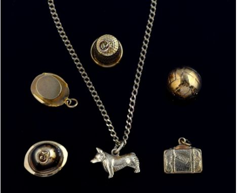 Group of gold charms including a football and a case marked Paris, and a corgi dog on gold chain  12.6 grams 