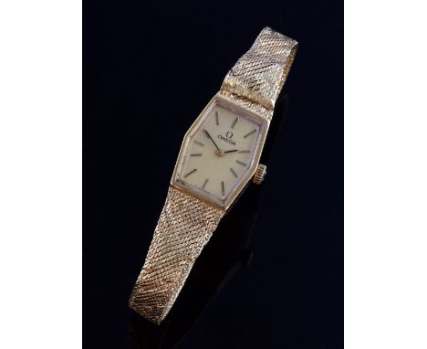 Ladies Omega 9ct gold bracelet watch, champagne colour dial, integral gold bracelet, manual winding movement, with box and pa
