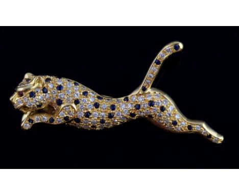 Sapphire diamond brooch in the form of a running cheetah with ruby set eye, in 18 ct gold, diamond weight estimated at 0.75 c