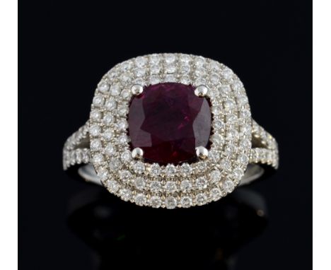 Ruby and diamond ring, the deep red colour ruby of cushion cut  weighing an estimated 2.30 carats with a three row diamond su