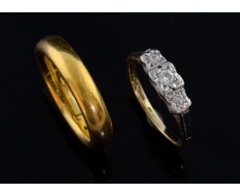 Edwardian three stone diamond ring in 18 ct gold and platinum, ring size K and a gold wedding band 22 ct, ring size L, cased 