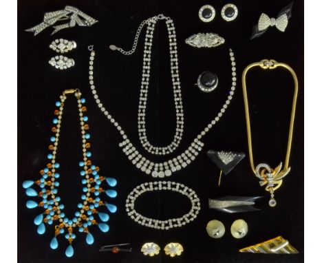 A collection of vintage jewellery, Art Deco early plastics and paste clips and brooches, a 1940's paste set necklace, signed 