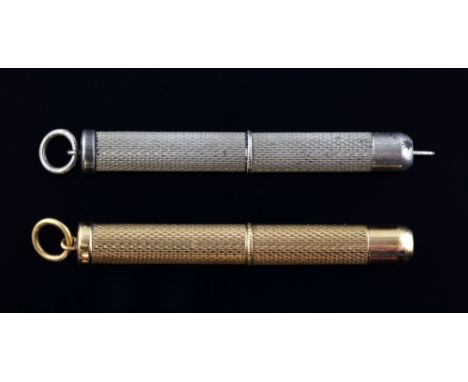 Two  tooth picks, gold with engine turned finish, hallmarked 9ct, and similar in silver   weight 6.8 grams 
