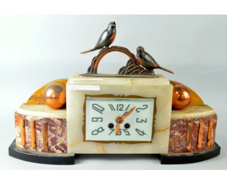 1920's onyx and pink marble and copper mounted twin train mantel clock, 30 x 54cm PROVENANCE: Consigned from a local deceased