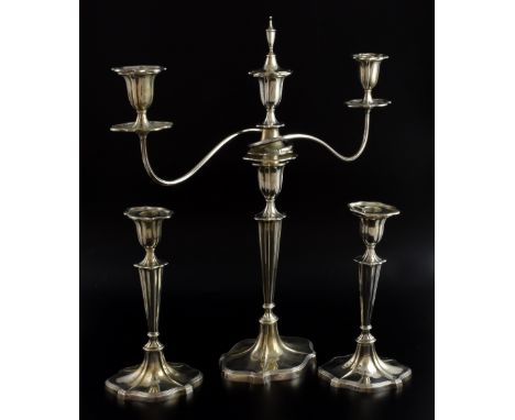 George V silver three-light candelabrum and a pair of matching candlesticks, Hawksworth, Eyre & Co. Ltd, Birmingham, 1934/193