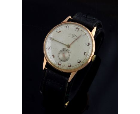 A rare vintage Grand Prix election 14ct gold watch, round silvered dial with Arabic numerals and subsidiary dial at 6. Manual
