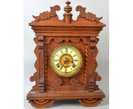 Three American walnut mantel clocksPROVENANCE: Consigned from a local deceased estate, the property of a clock restorer.     