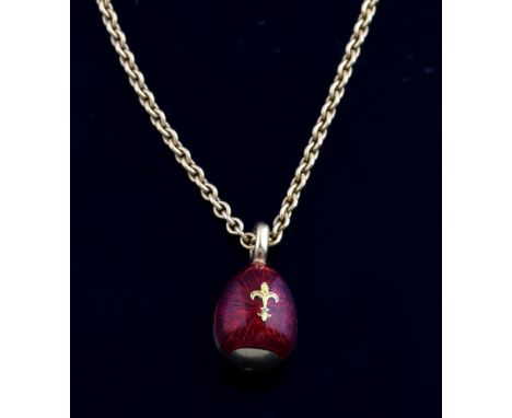 Faberge contemporary red enamel egg pendant inlaid with gold fleur-de-lys, 1.4 cm,  on 18 ct gold chain with label Faberge ma