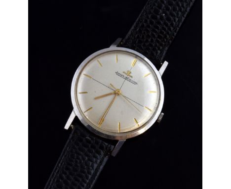 Jaeger Lecoultre gentleman's stainless steel watch, ref 2285, silver dial with gold baton markers, on leather strap. Manual w