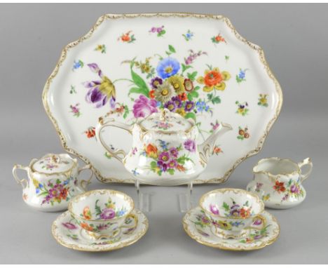 Early 20th century Dresden cabaret set comprising tea pot, cream jug, sugar bowl, two tea cups with saucers and tray all hand