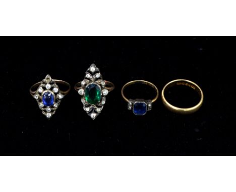 Three Edwardian paste set rings, in gold and silver setting, ring size  and a gold wedding band, ring size M wedding band 3.1