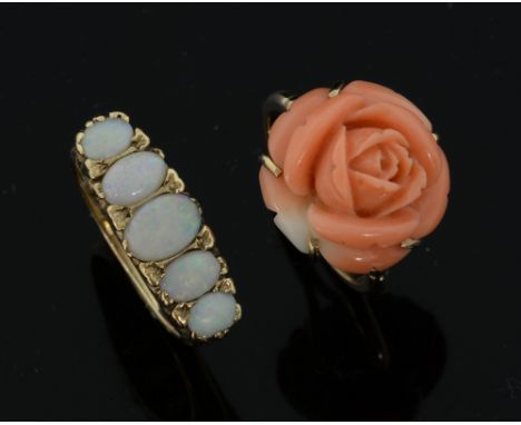 A ring set with carved coral rose, ring size - N, unmarked, and a five stone opal set ring in carved setting, ring size - P, 