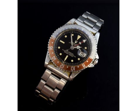 Rolex, a rare Oyster GMT Master Automatic stainless steel watch, Ref 1675. Matt black dial with luminous dot hour markers and