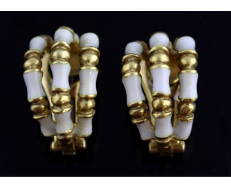 Gold and white enamel clip on earrings, marked 18ct, tested as 18 ct gold,  2 x 1 cm Gross weight 17.3 grams
