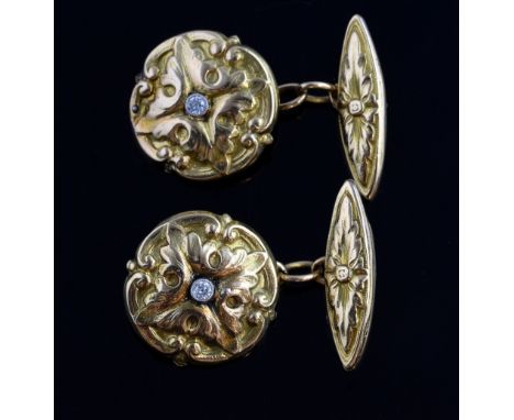 A pair of late 19th C Gothic Revival circular gold cufflinks, mounted in yellow gold with a diamond set to the centre.Tested 
